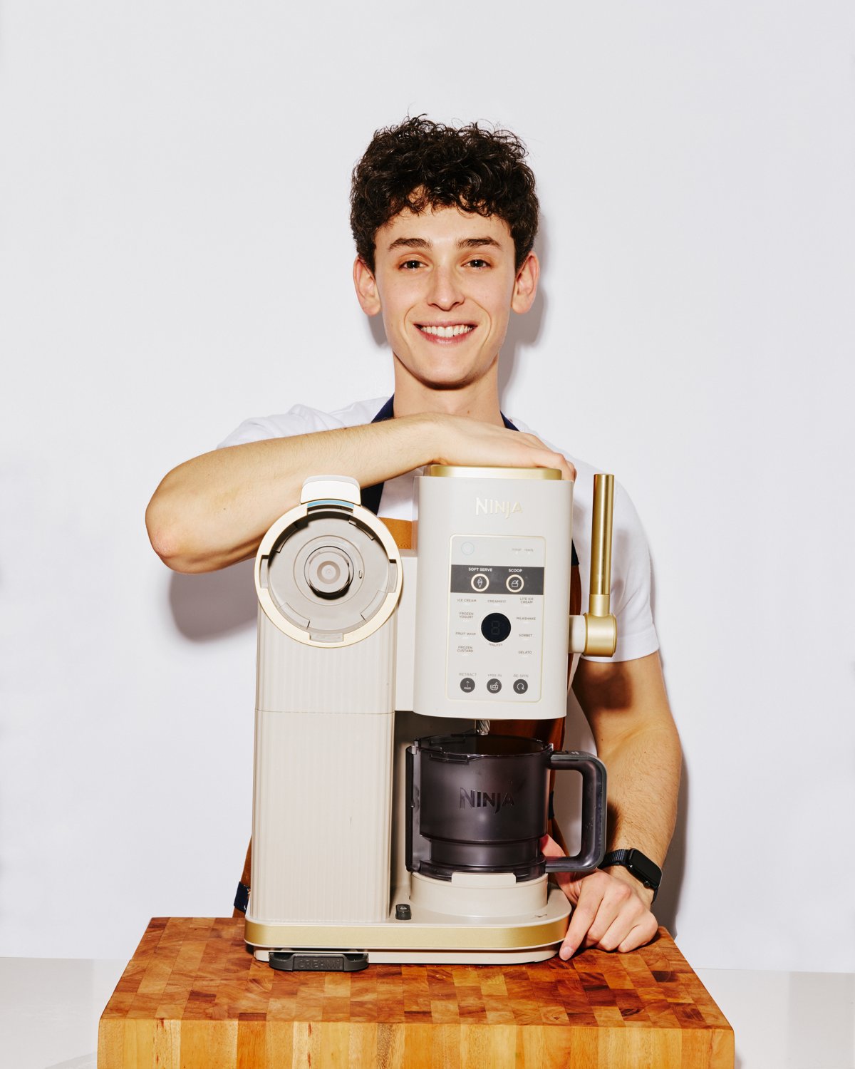 Eli Mack, creator of Creami Cravings, standing with a Ninja Creami ice cream machine